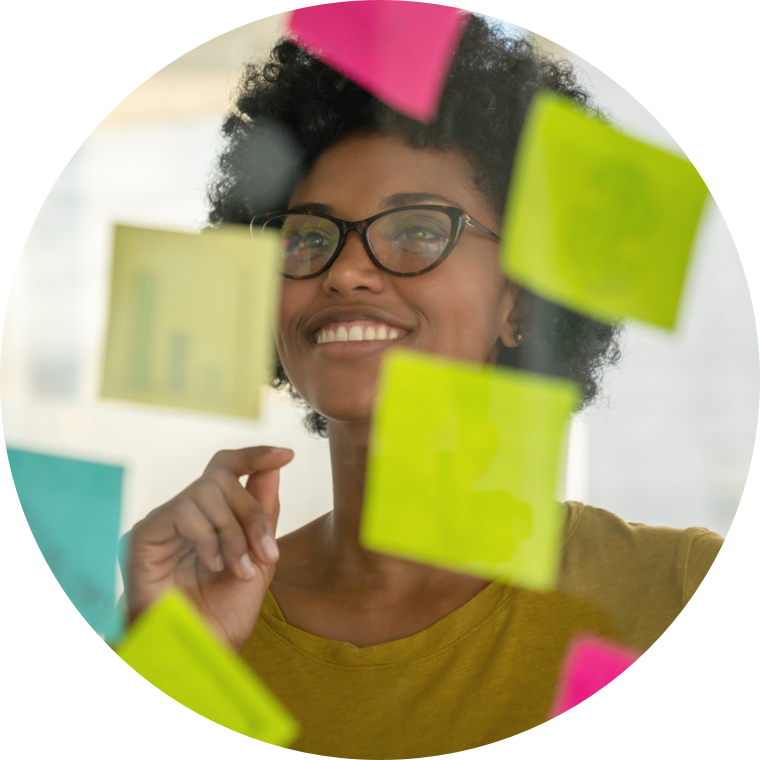 Woman looking at sticky notes